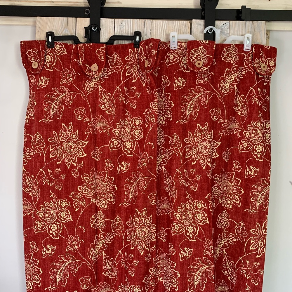 Waverly curtain panels with button over accent tabs at top.